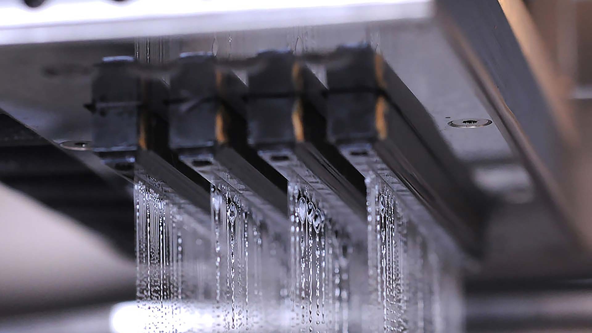 Metal 3D printing comparison showing binder jetting and DMLS processes side by side